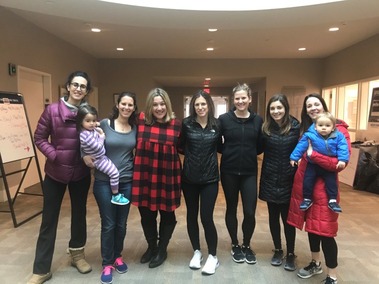 "These days, I look forward to school pick-up: we commiserate about the nightmare that is bedtime, make wine dates and help shepherd each other's kids to the parking lot," says Rachel Paula Abrahamson, in the red dress, posing with her friends.