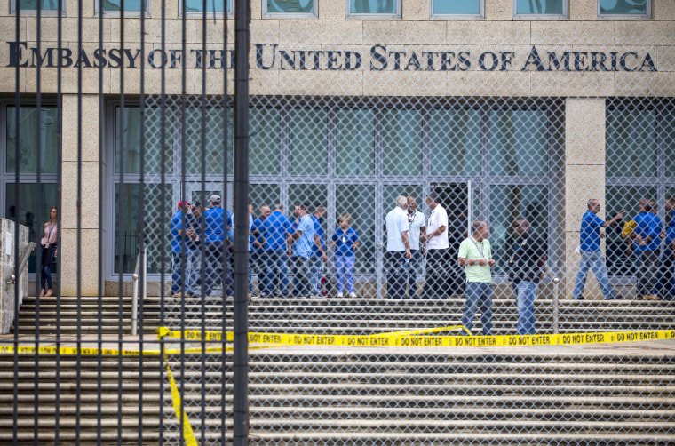 Image: Staff stand within the United States embassy facility in Havana, Cuba on Sept. 29, 2017.