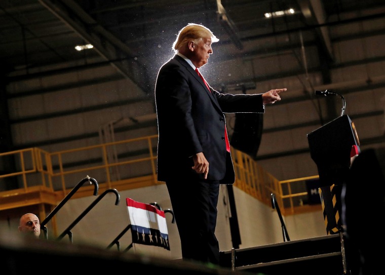 Image: United States President Trump gestures during a campaign rally in Pensacola