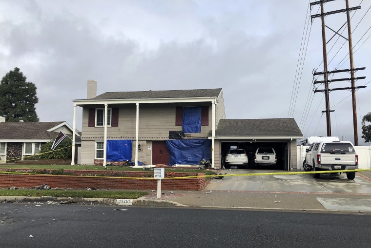 Image: Damage and debris outside a home after a small plane crash in Yorba Linda, California, on Feb. 4, 2019.