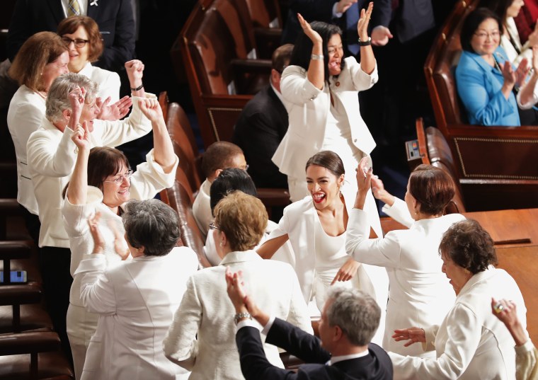 Image: Female lawmakers cheer during President Donald Trump's State of the Union address