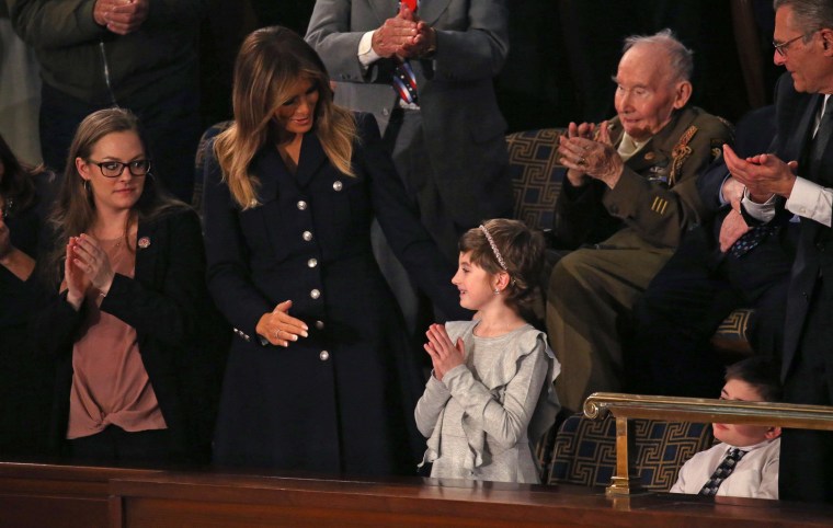 Image: First lady Melania Trump talks with cancer survivor Grace Eline as U.S. President Trump delivers his second State of the Union address to a joint session of the U.S. Congress in Washington
