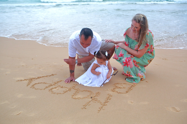 Sothy Kum with his wife, Lisa, and their daughter.