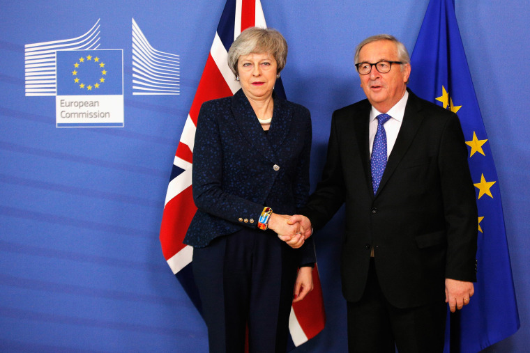 Image: Jean-Claude Juncker receives Theresa May in the VIP corner of The Berlaymont, the headquarters of the European Commission