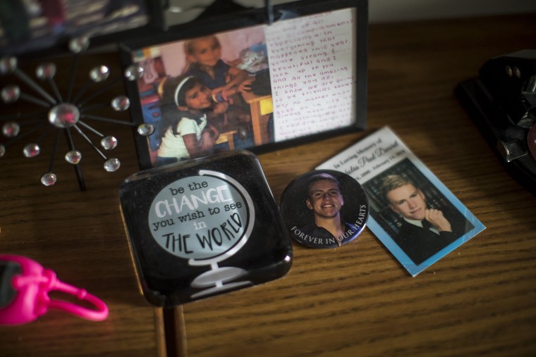 Alexandra Greenwald keeps the memorial card for Nick Dworet in her dorm room.