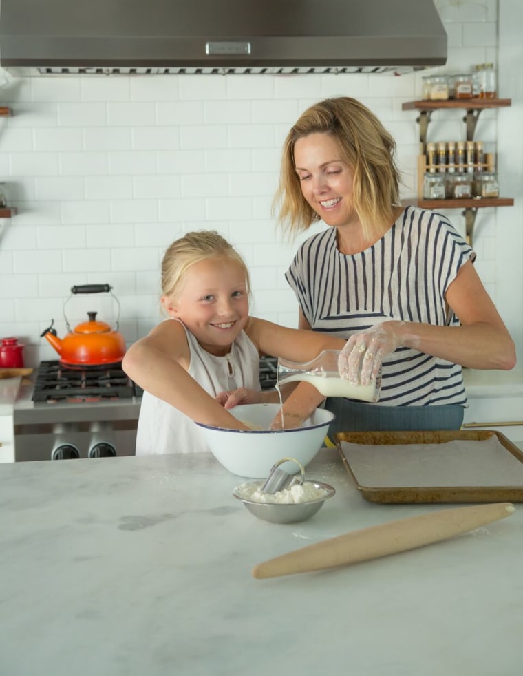 Carrie Morey of Charleston's Callie's Hot Little Biscuits prepares a batch of biscuits with her daughter.