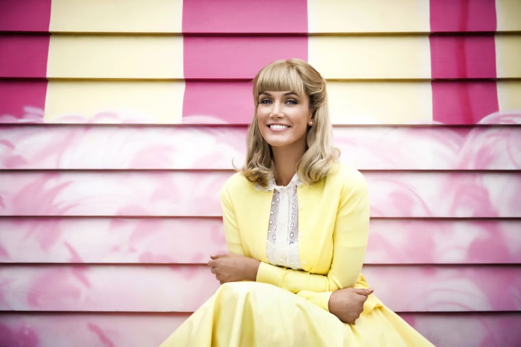 Delta Goodrem stars in Lifetime’s debut of "Olivia Newton John: Hopelessly Devoted to You," premiering Saturday, February 16.