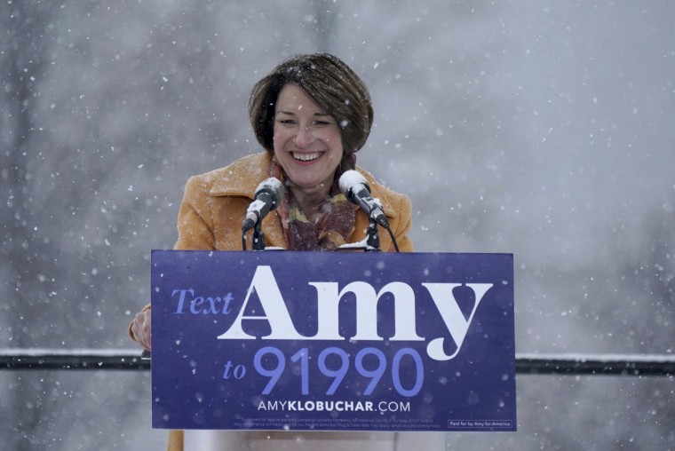 Image: Sen. Amy Klobuchar greets the crowd before announcing her bid for president at Boom Island Park in Minneapolis