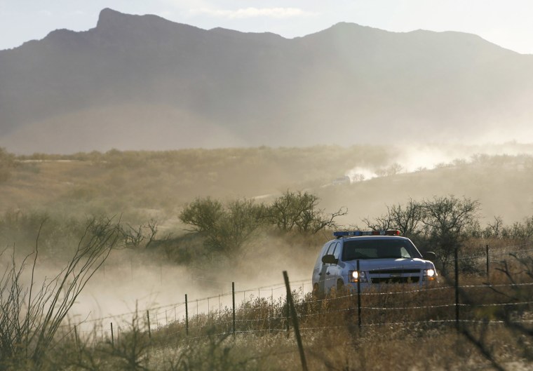A U.S. Border Patrol vehicle returns from the scene of an overnight shootout where Border Patrol Agent Brian Terry was killed northwest of Nogales, Ariz.