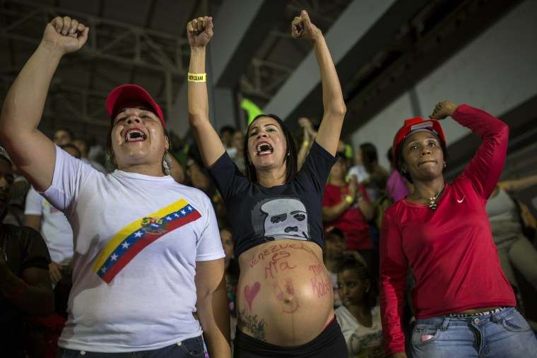 Image: Marzuni, whose pregnant belly reads "Venezuela is mine" in Spanish, cheers from the audience at taping of Diosdado Cabello's TV program on Feb. 6, 2019.