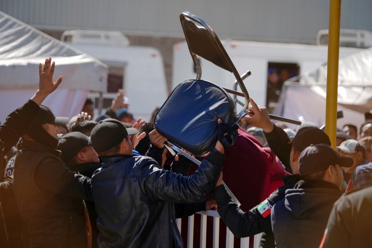 Image: Migrants clash with security agents at a provisional shelter in Piedras Negras, Mexico, on Feb. 13, 2019.