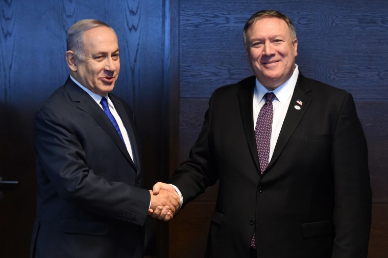 Image: Israel's Prime minister of Benjamin Netanyahu shake hands with US Secretary of State Mike Pompeo as they talk to the press on the sidelines of a session at the conference on Peace and Security in the Middle east in Warsaw