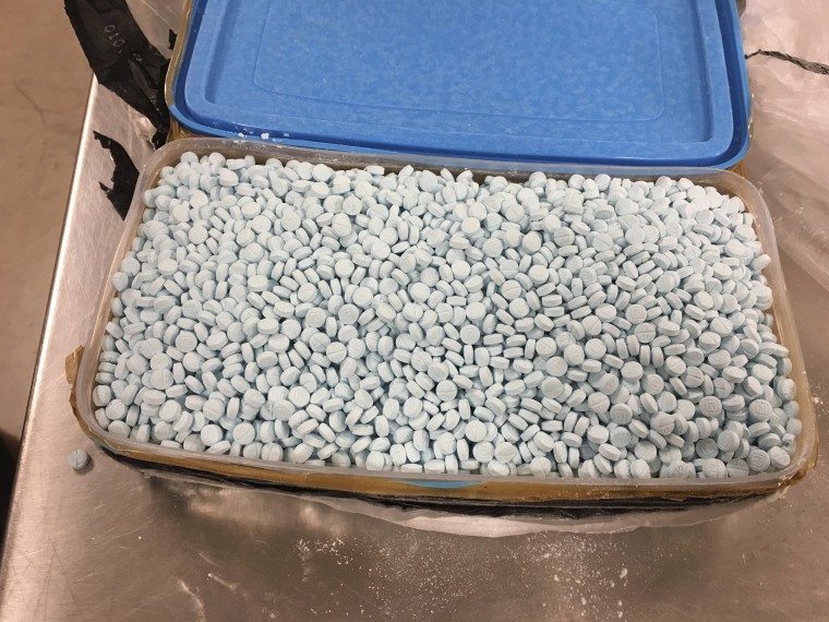 Image: Some of the 30,000 fentanyl pills the Drug Enforcement Administration seized in a bust in Tempe, Arizona, in August 2017.