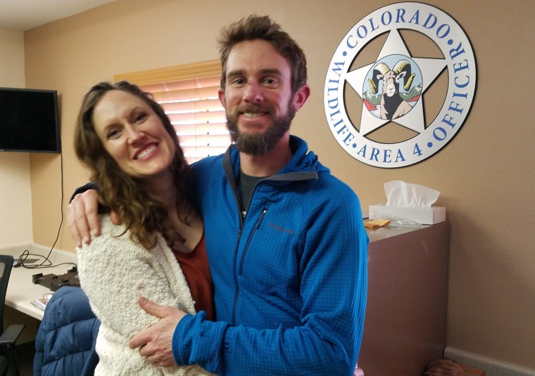 Image: Annie Bierbouer and Travis Kauffman embrace before a press conference in Colorado.