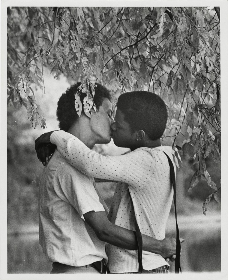 Men kissing under a tree in Philadelphia in 1977