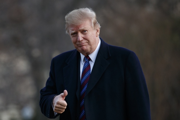 President Donald Trump gives the thumbs-up after returning to the White House following his annual physical exam on Feb. 8, 2019.