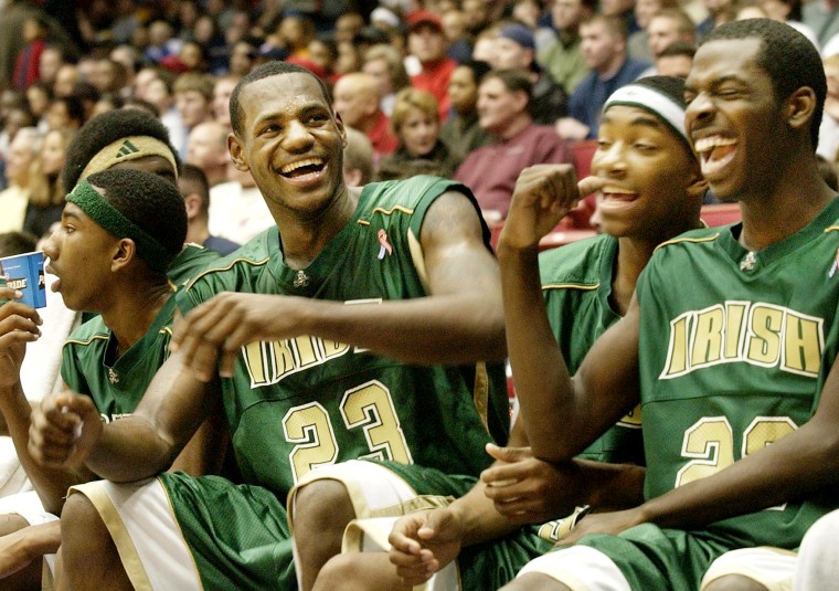 ST. VINCENT-ST. MARY LEBRON JAMES LAUGHS WITH HIS TEAMMATES.
