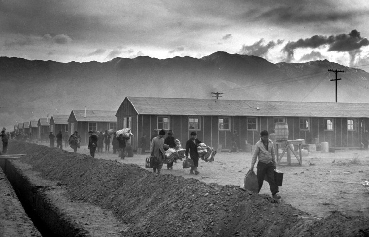 Image: A group of Japanese-Americans arrive at the Manzanar internment camp in Owens Valley, California, on March 21, 1942.