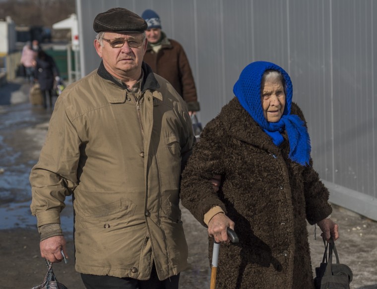 Retirees living in separatist territory must cross the front line every month to collect their pension checks