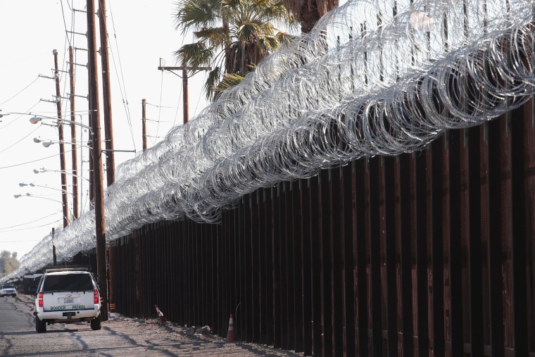 Image: A border patrol agent keeps watch along the U.S.-Mexico border on Jan. 25, 2019 near Calexico, California