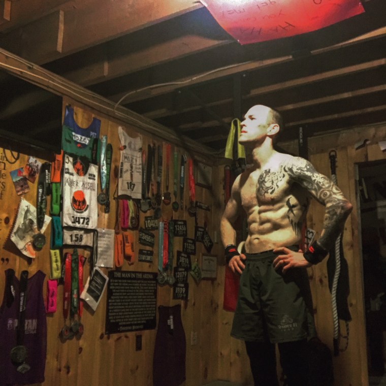 Jason Mosel in his workout room after completing 1,500 burpees in February 2019.