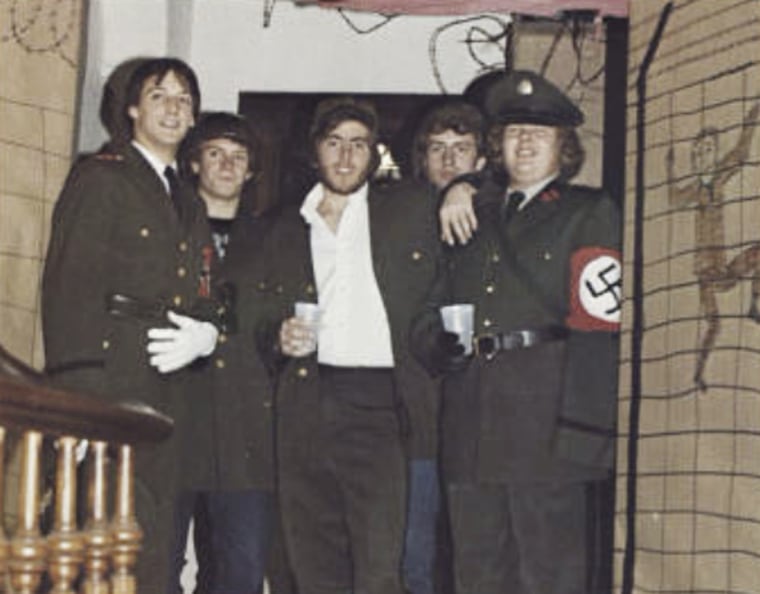 Bob Garthwait, right, wears a costume that depicts a Nazi uniform at a fraternity event, in a photo from the 1980 edition of Spectrum, the Gettysburg College yearbook.