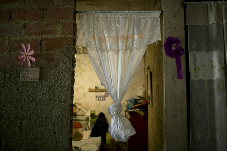 Image:  A curtain hangs in the doorway of Jhonny Godoy's bedroom in La Vega, Venezuela, on Feb. 19, 2019.