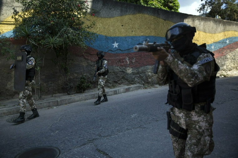 Image: Members of the National Police Action Force patrol the Antimano neighborhood of Caracas, Venezuela, on Jan. 29, 2018.