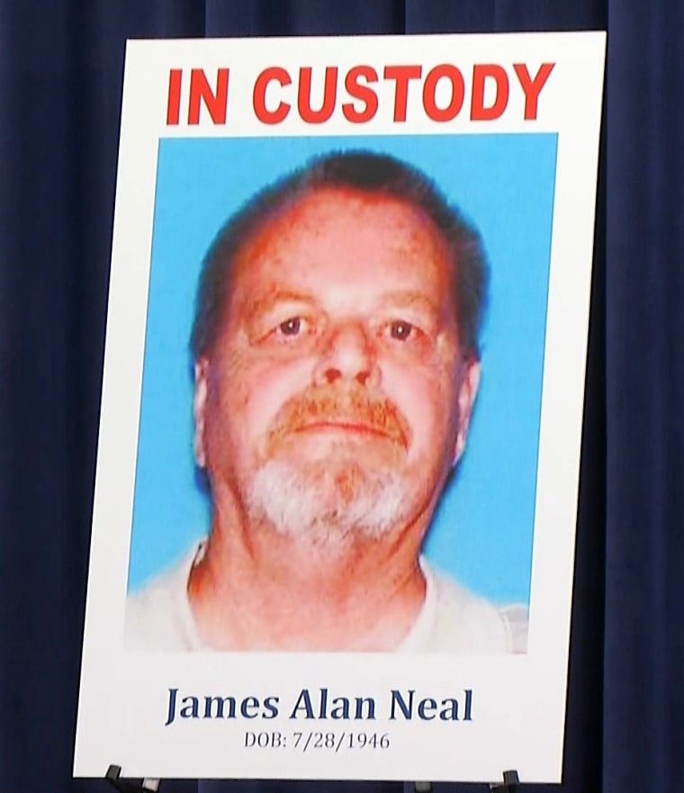 A poster of James Alan Neal during the Newport Beach police and Orange County prosecutors news conference on Feb. 20, 2019.