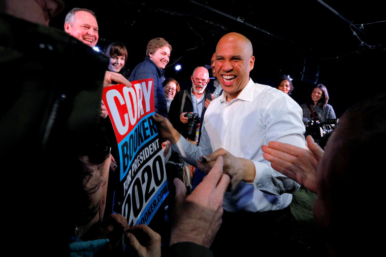 Image: Sen. Cory Booker, D-NJ, greets audience members at a campaign stop in New Hampshire on Feb. 16, 2019.