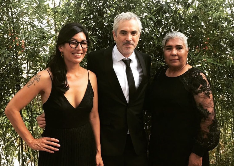 Image: Ai-jen Poo, director of the National Domestic Workers Alliance (NWDA), with "Roma" director Alfonso Cuaron and NWDA member Rosa Sanluis.