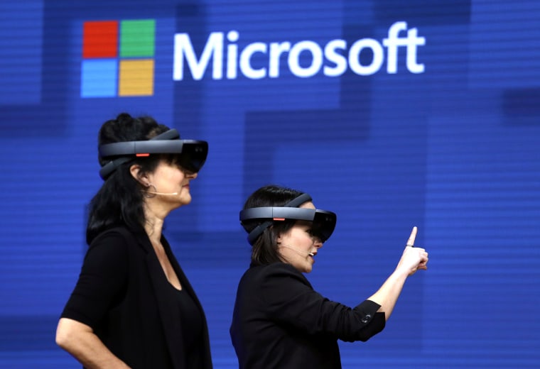 Members of a design team at Cirque du Soleil demonstrate use of Microsoft's HoloLens device in helping to virtually design a set at the Microsoft Build 2017 developers conference in Seattle on May 11, 2017.