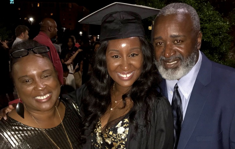 Image: Nathaniel Rhodes, right, with his wife, Annette, and daughter.
