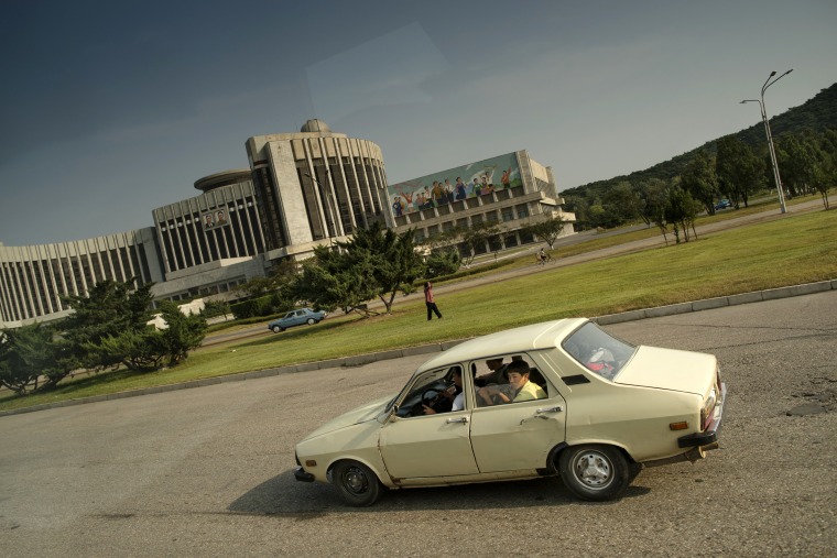 Image: A car drives through Pyongyang, North Korean, on Sept. 18, 2013.