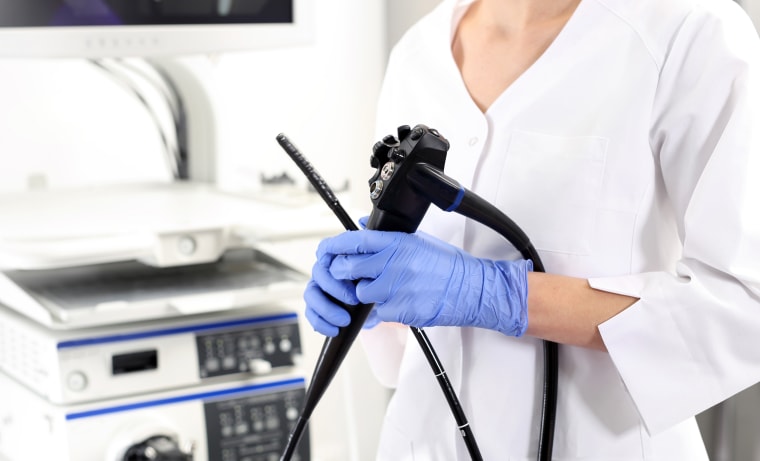 A gastroenterologist with probe to perform gastroscopy and colonoscopy