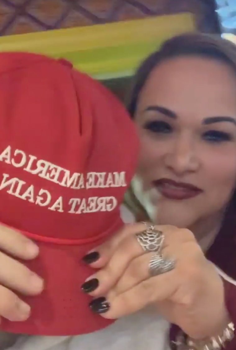 Rosiane Santos holds down Bryton Turner's MAGA hat over his face