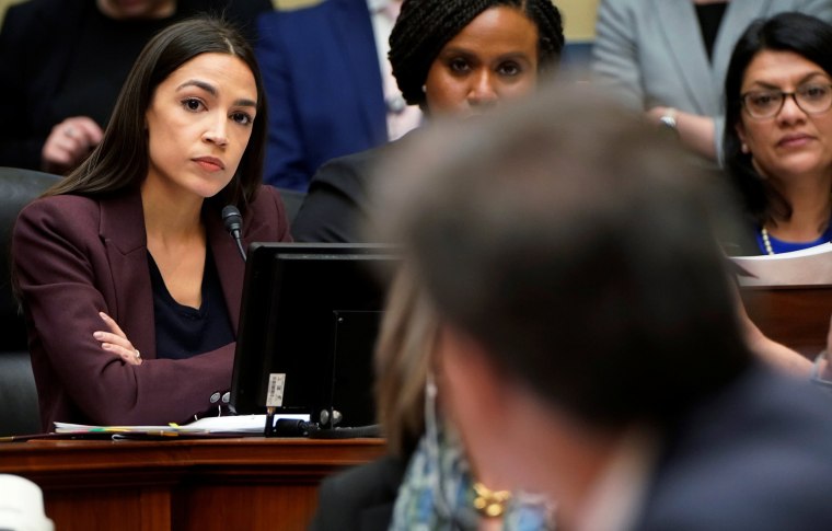 Image: Rep. Alexandria Ocasio-Cortez questions former Trump personal attorney Cohen at House Oversight hearing on Capitol Hill in Washington
