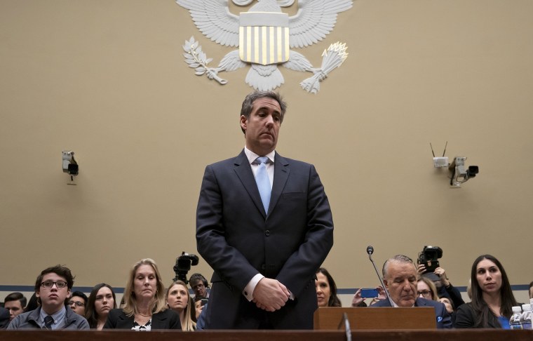 Image: Michael Cohen, President Donald Trump's former personal lawyer, pauses just after being sworn in to testify before the House Oversight and Reform Committee on Capitol Hill