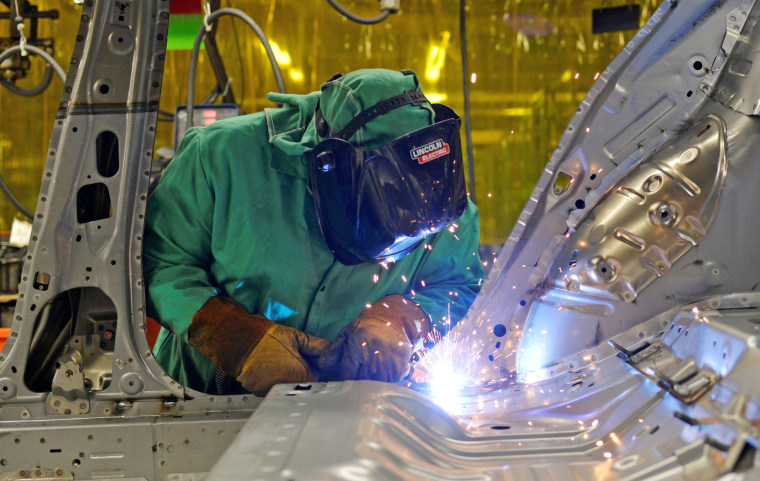 Image: FILE PHOTO: Line workers spot weld parts of the frame on the flex line at Nissan Motor Co's automobile manufacturing plant in Smyrna Tennessee