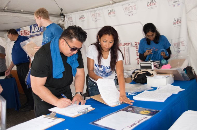 The Iowa Asian Alliance hosting a voter registration booth at a 2016 community event.