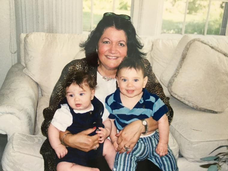 Lili Khabie holding two out of her six grandsons, David, left, and Nate, right.