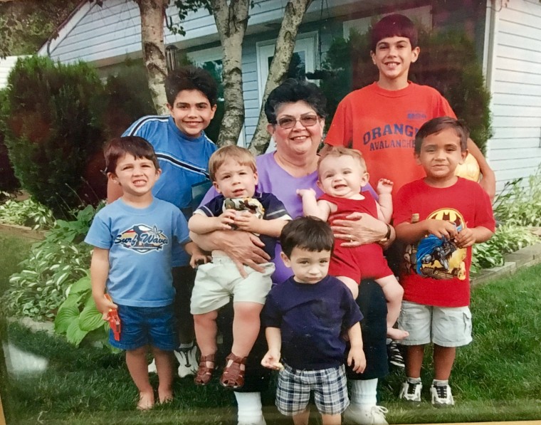 Luz Rodriguez with seven of her eight grandchildren