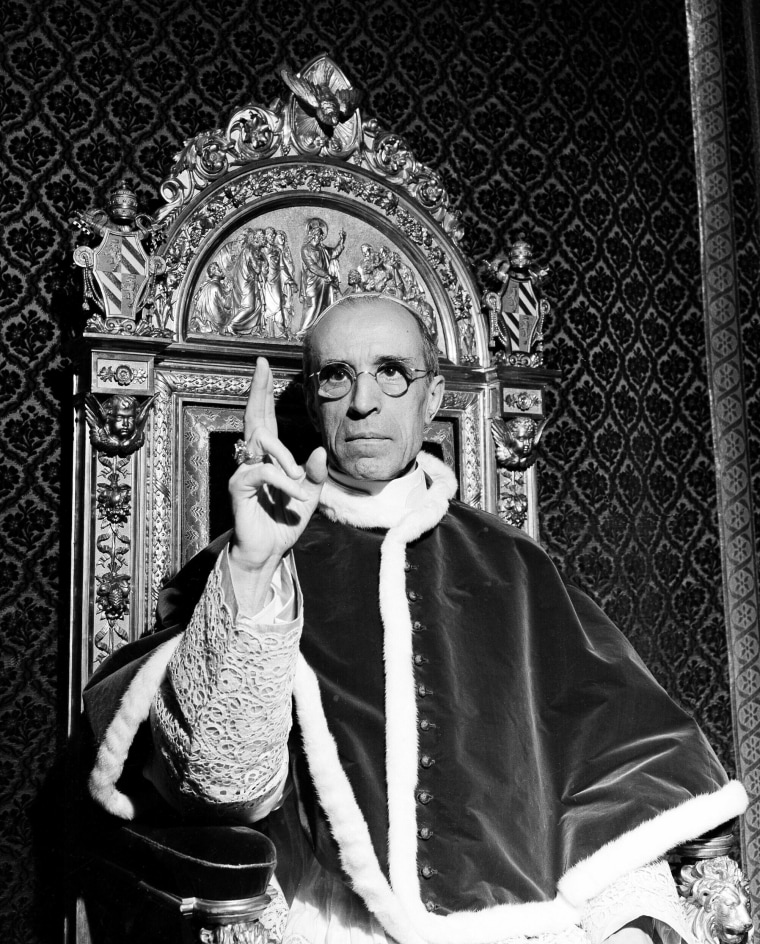 Image: Pope Pius XII gives a papal blessing at the Vatican in September 1945.