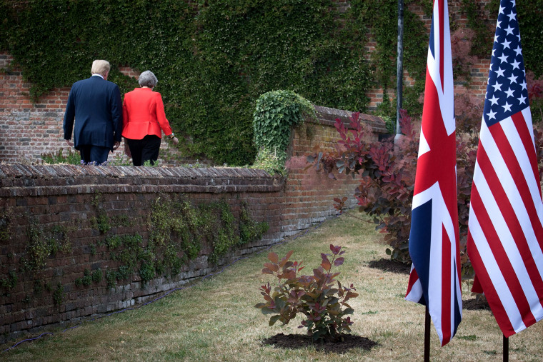 Image: President Donald Trump and British Prime Minister Theresa May walk following a press conference in London on July 13, 2018.