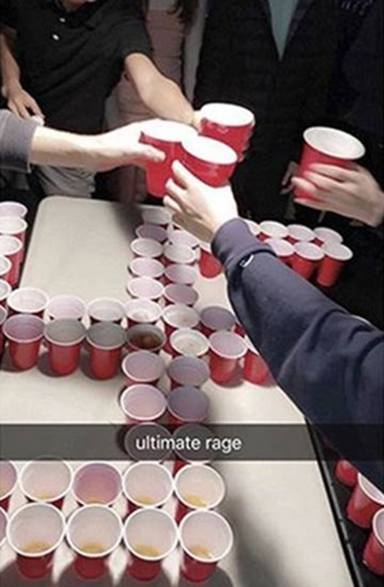 Image: Newport-Mesa students toast over a swastika made from red plastic cups. The "ultimate rage" banner on the image was added by the social media user.