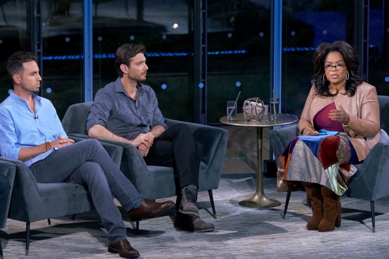 Image: Oprah Winfrey talks with Wade Robson and James Safechuck about the documentary "Leaving Neverland" in New York on Feb. 27, 2019.