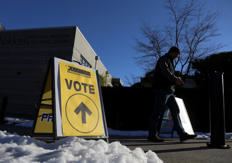 Image: A man leaves a polling station during the Burnaby South federal by-election in British Columbia, Canada, on Feb. 25, 2019.