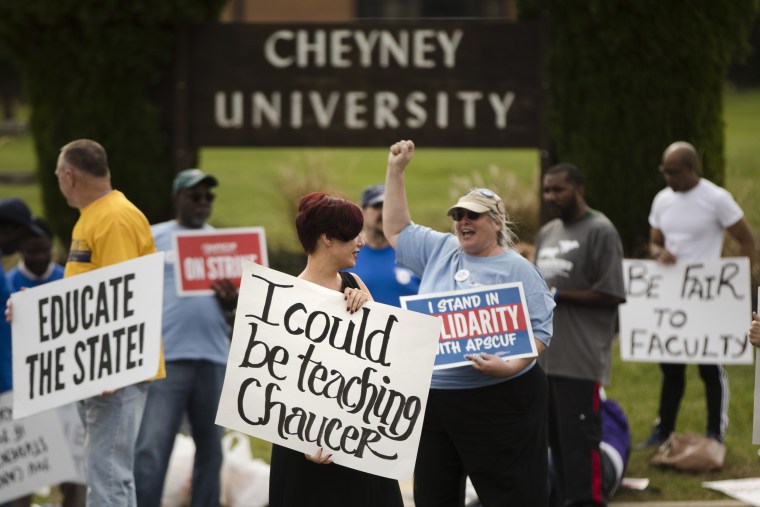 Faculty member Angela Florschuetz, center, her colleagues, and their supporters picket at Cheyney University in Cheyney, Pennsylvania, on Oct. 20, 2016.