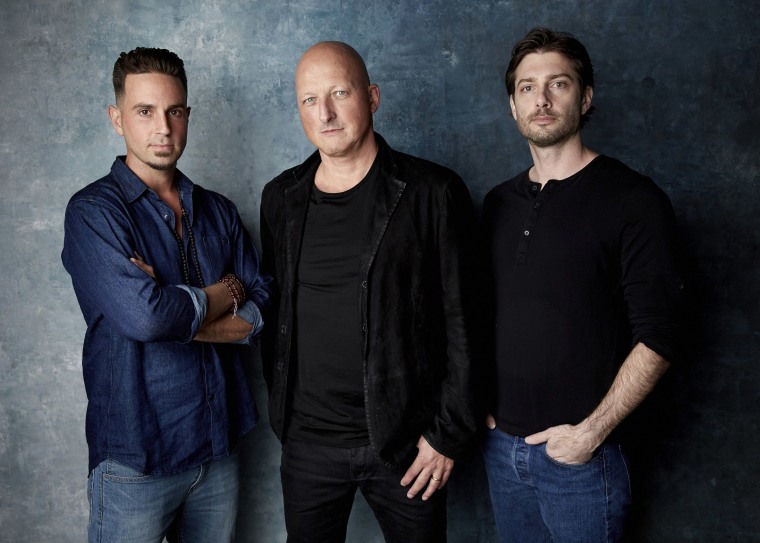Image: Wade Robson, director Dan Reed and James Safechuck pose for a portrait to promote the film "Leaving Neverland" during the Sundance Film Festival in Park City