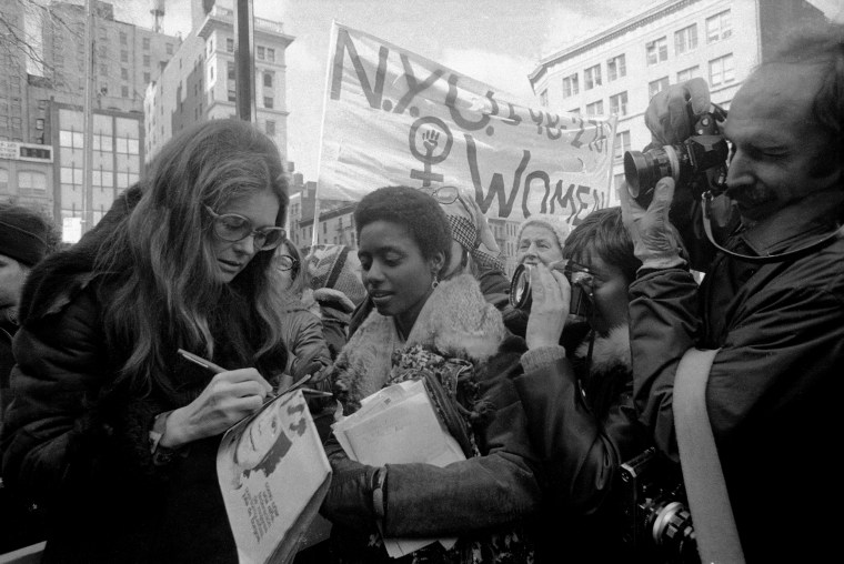 Image: Feminist activist Gloria Steinem joins marchers before the International Women's Day March in New York in 1975.